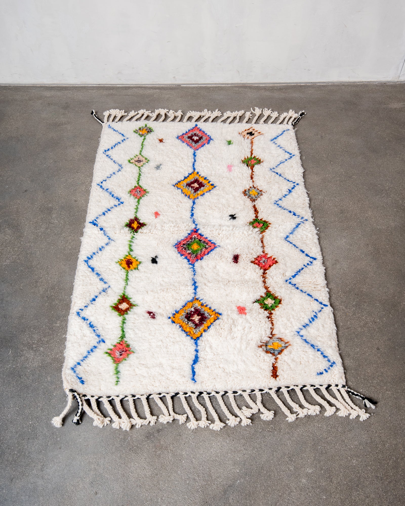 Modern, designer, handcrafted Berber rug from Morocco. Beniourain carpet with beautiful colours and patterns and fluffy wool texture.